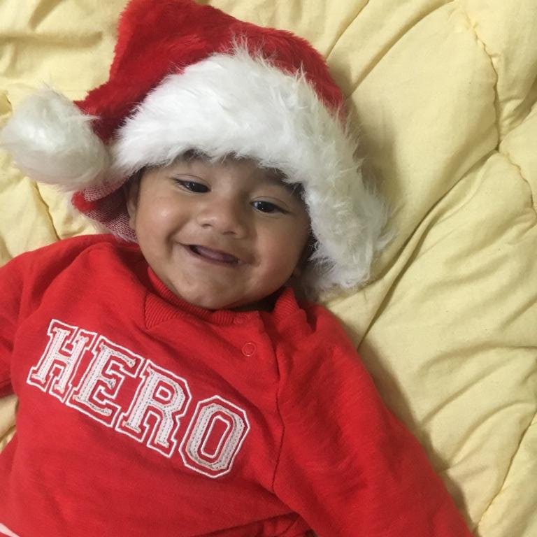 Baby Dhruv in Santa Claus cap.JPG