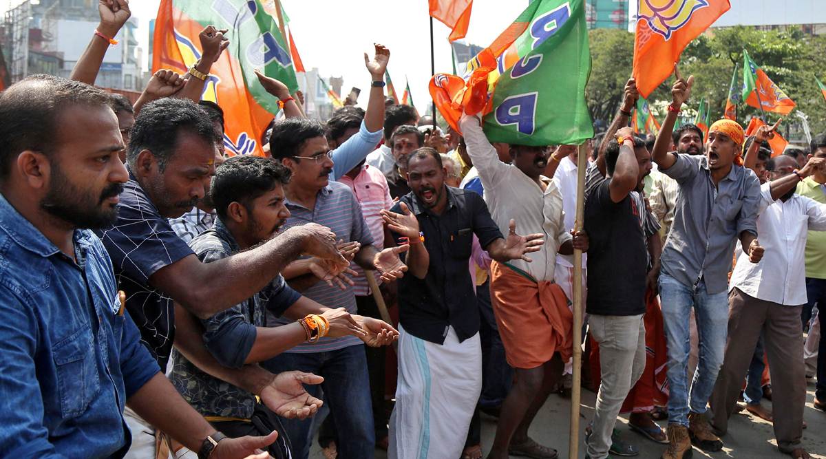Supporters of India's ruling BJP shout slogans as they block a highway during a protest against the arrest of their leader K Surendran in Kochi