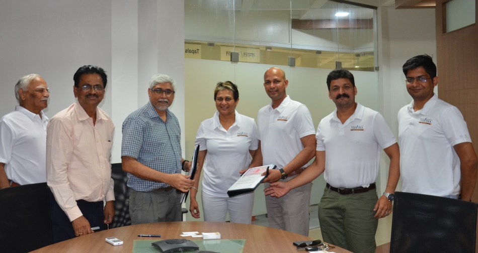 Prof. Ravindra Gettu (3rd LEFT), Dean (ICSR), IIT Madras, & Ms. Durga Das (4th LEFT), CEO of Teerthaa, displaing the MoU on collaboration.jpg