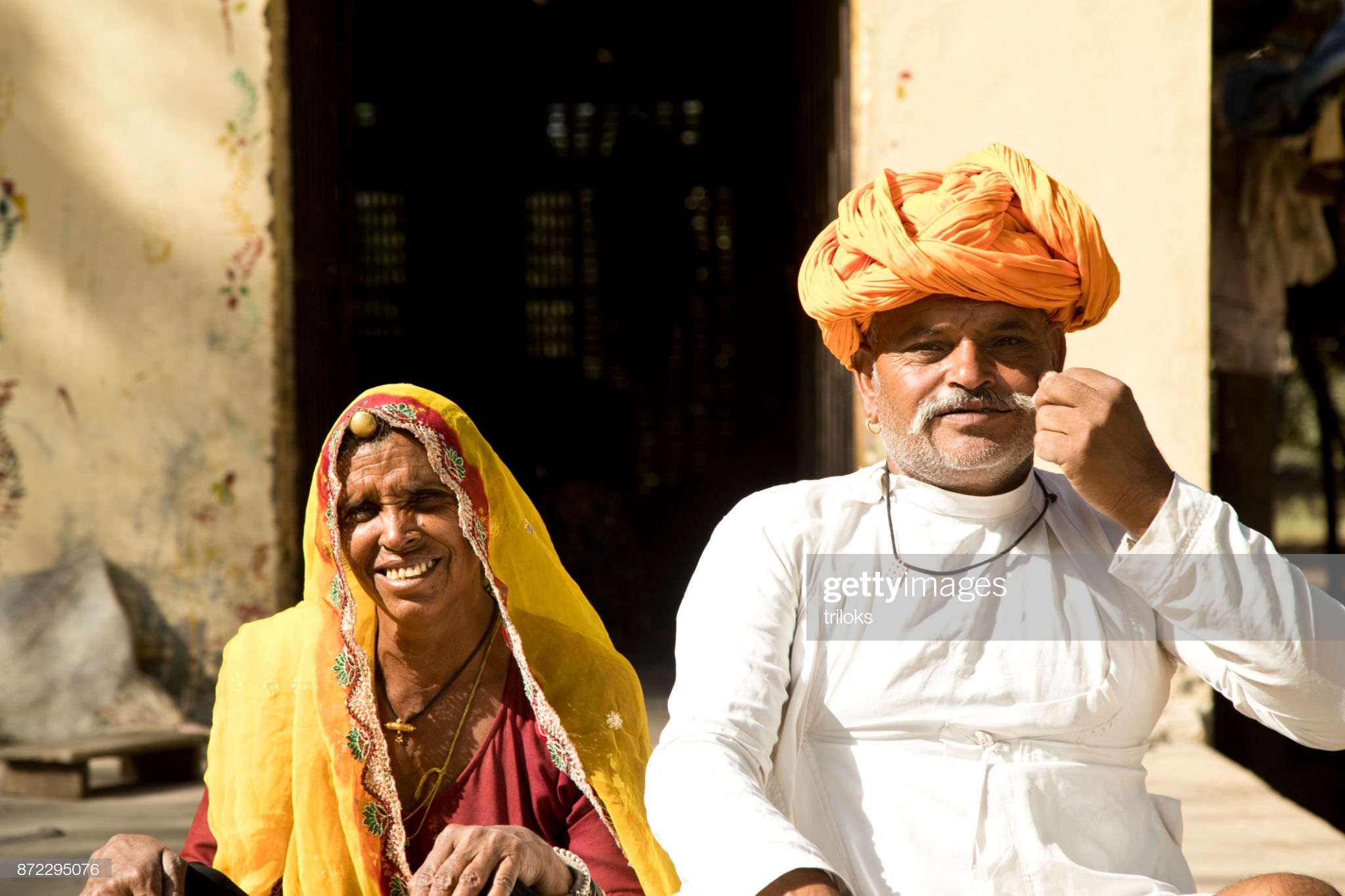 Portrait of mature Indian couple in traditional clothing at village